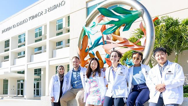 MD students outside the Schmidt College of Medicine building